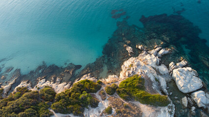 Aerial drone view of rocks, water and forest near the twin beaches of Karidi and small Karidi, Vourvourou, Sithonia peninsula, Halkidiki, North Greece