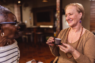 Happy ladies enjoying the day having coffee.
