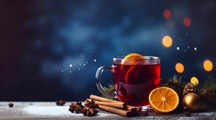 Christmas mulled red wine with spices and fruits on a blue background. Traditional hot drink at...