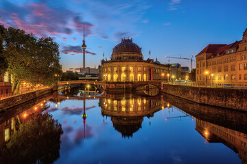 The Bode-Museum and the Television Tower reflected in the river Spree in Berlin before sunrise
