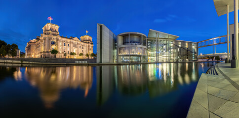Panorama of the Reichstag and the Paul-Loebe-Haus at the river Spree in Berlin at dawn