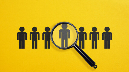 Ideal customer is shown in group of people using the magnifying glass