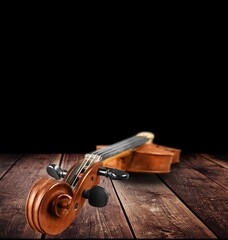 A violin music instrument on the wooden table