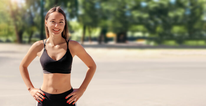 close up portrait of a athletic woman in the park. Sports, workout outdoors