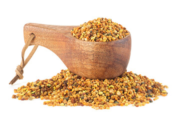 Organic bee pollen in wooden spoon isolated on a white background, healthy food supplements. Dried...
