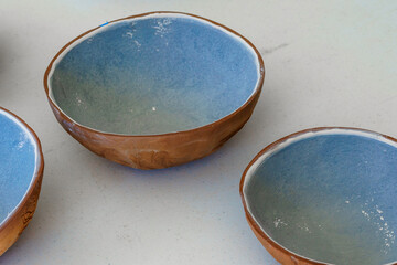 Handmade terra cotta clay bowls with blue glaze