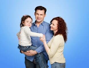 Image of  happy young family posing on background