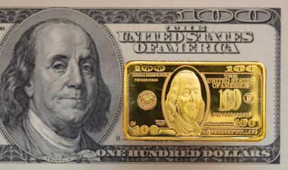 US 100 dollar golden bar die cut stamp on US 100 dollar banknote background - obrazy, fototapety, plakaty