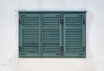 Fototapeta na wymiar Old window in Mediterranean architecture.