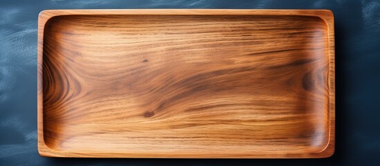 Rectangular wooden tray on dark blue table minimal kitchen flat lay - Powered by Adobe