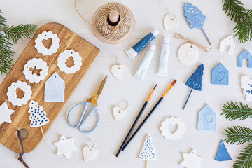 Top view of handmade christmas ornaments made of air dry clay. Xmas crafts, hobby, diy concept