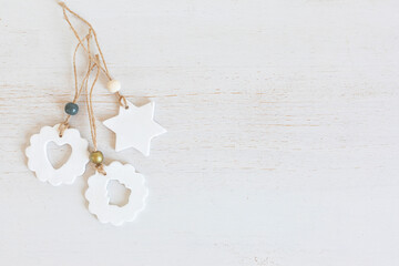 Top view of handmade christmas ornaments made of air dry clay. Xmas crafts, hobby, diy concept