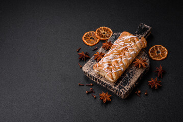 Delicious crispy braided bun with raisins inside and white icing outside