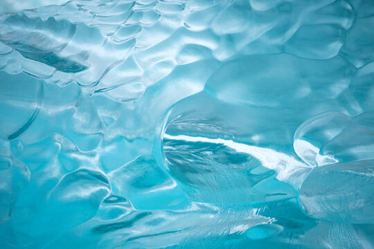 Close-up of a hole gouged into an iceberg at the waterline near the Sawyer Glacier, Tracy Arm-Fords Terror Wilderness Area, Inside Passage, Alaska, USA; Alaska, United States of America