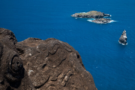 Orongo rocks are carved with hundreds of petroglyphs of birdmen.; Orongo, Rapa Nui, Easter Island, Chile
