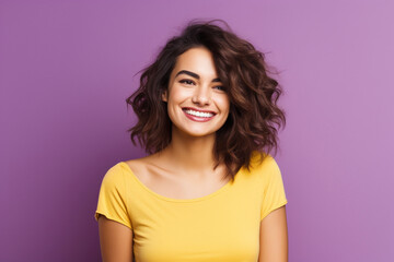 Fototapeta premium A portrait of a young american woman against a purple background. Minimalistic style image for business banner.