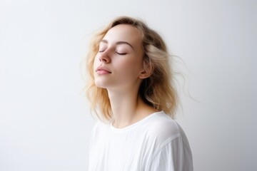 Portrait of a girl enjoys with closed eyes