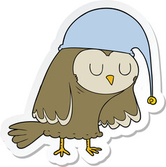 sticker of a cartoon owl sleeping