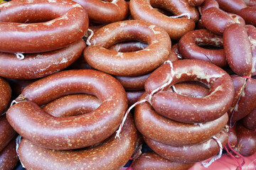 sausages ( turkish sucuk) on hangers in bazaar	