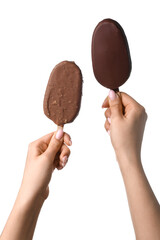 Woman holding delicious chocolate covered ice cream on stick against white background