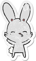 distressed sticker of a curious bunny cartoon