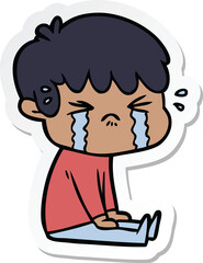 sticker of a cartoon boy crying