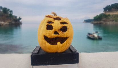 A cute smiling pumpkin. Decoration of the embankment for Halloween.