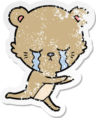 distressed sticker of a crying cartoon bear