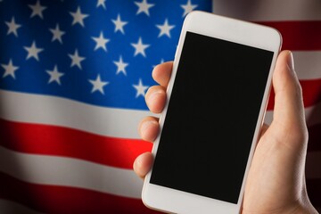 Mobile phone with a blank screen and USA flag.