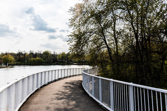 Pedestrian bridge in Bordei park over the lake. Bucharest, Romania.