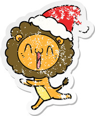 happy hand drawn distressed sticker cartoon of a lion wearing santa hat