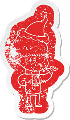 nervous quirky cartoon distressed sticker of a boy wearing santa hat
