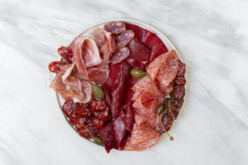 Food aperitif Italian prosciutto ham, parma ham, salami, bresaola beef olives and grissini...
