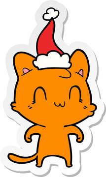 hand drawn sticker cartoon of a happy cat wearing santa hat