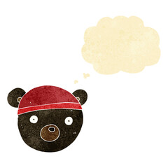 cartoon black bear cub wearing hat with thought bubble