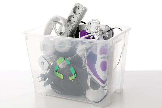 Recycle bin with different household appliances on white background
