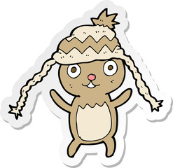 sticker of a cartoon bear in hat