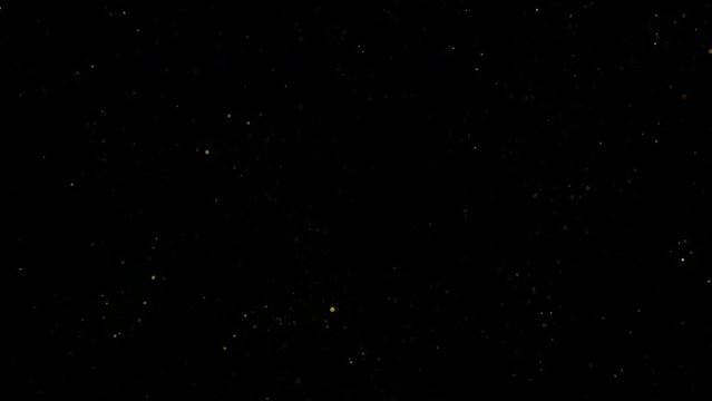 4k Gold Particles Explosion. Motion Background. Golden glitter particle. On Black Backdrop. Animated Overlay. Defocused bokeh. Falling down glitzy lights. 2160p. 60 fps