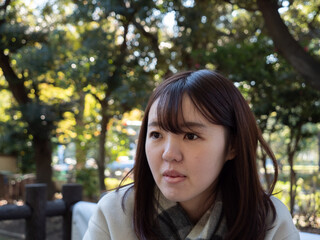 A Beautiful young Japanese woman looking shocked in winter clothes - 653950785