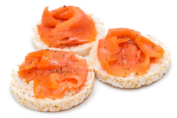 Tasty Rice Cake Sandwiches with Fresh Salmon Slices Isolated on White. Easy Breakfast and Diet Food. Crispbread with Red Fish. Healthy Dietary Snacks - Isolation