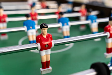 Close-up of figures of plastic players in a football match.