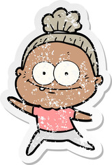 distressed sticker of a cartoon happy old woman