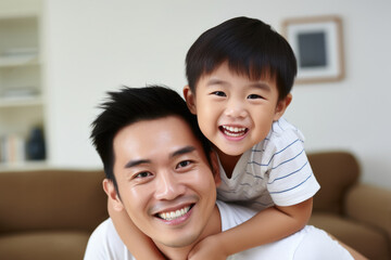 Picture of man carrying young boy on his shoulders. This image can be used to depict father and son bonding, family outings, or fun day at park.