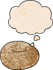 cartoon donut with thought bubble in grunge texture style