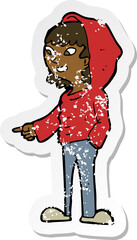 retro distressed sticker of a cartoon pointing teenager