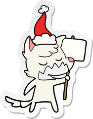 friendly hand drawn sticker cartoon of a fox wearing santa hat