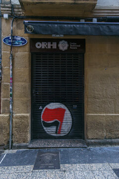 closed door of a shop with graffiti of flag of antifacism in city of San Sebastian or Donostia, Basque Country, Spain