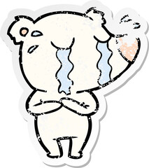 distressed sticker of a cartoon crying polar bear