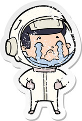 distressed sticker of a cartoon crying astronaut