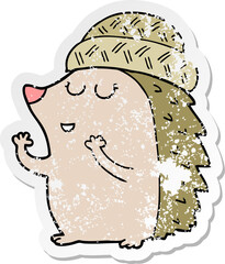distressed sticker of a cartoon hedgehog wearing hat